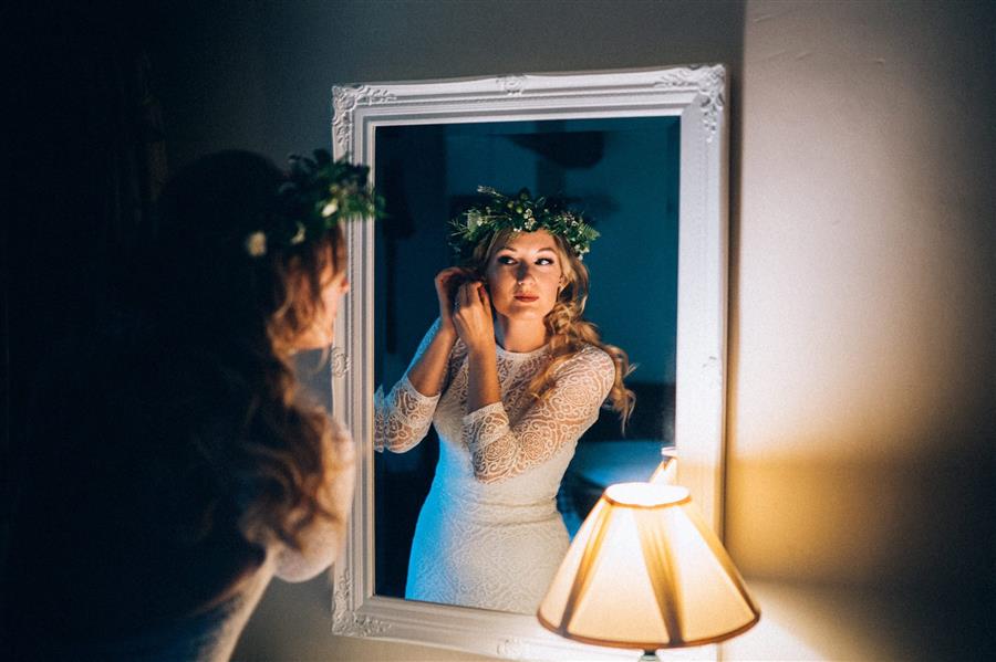 Bride to be in a mirror with a flower crown by Ed Godden Photography